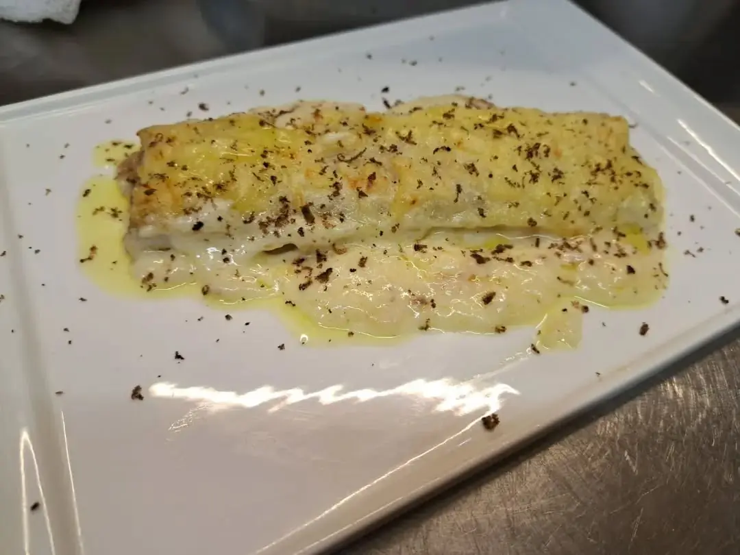 Plato de pescado en salsa